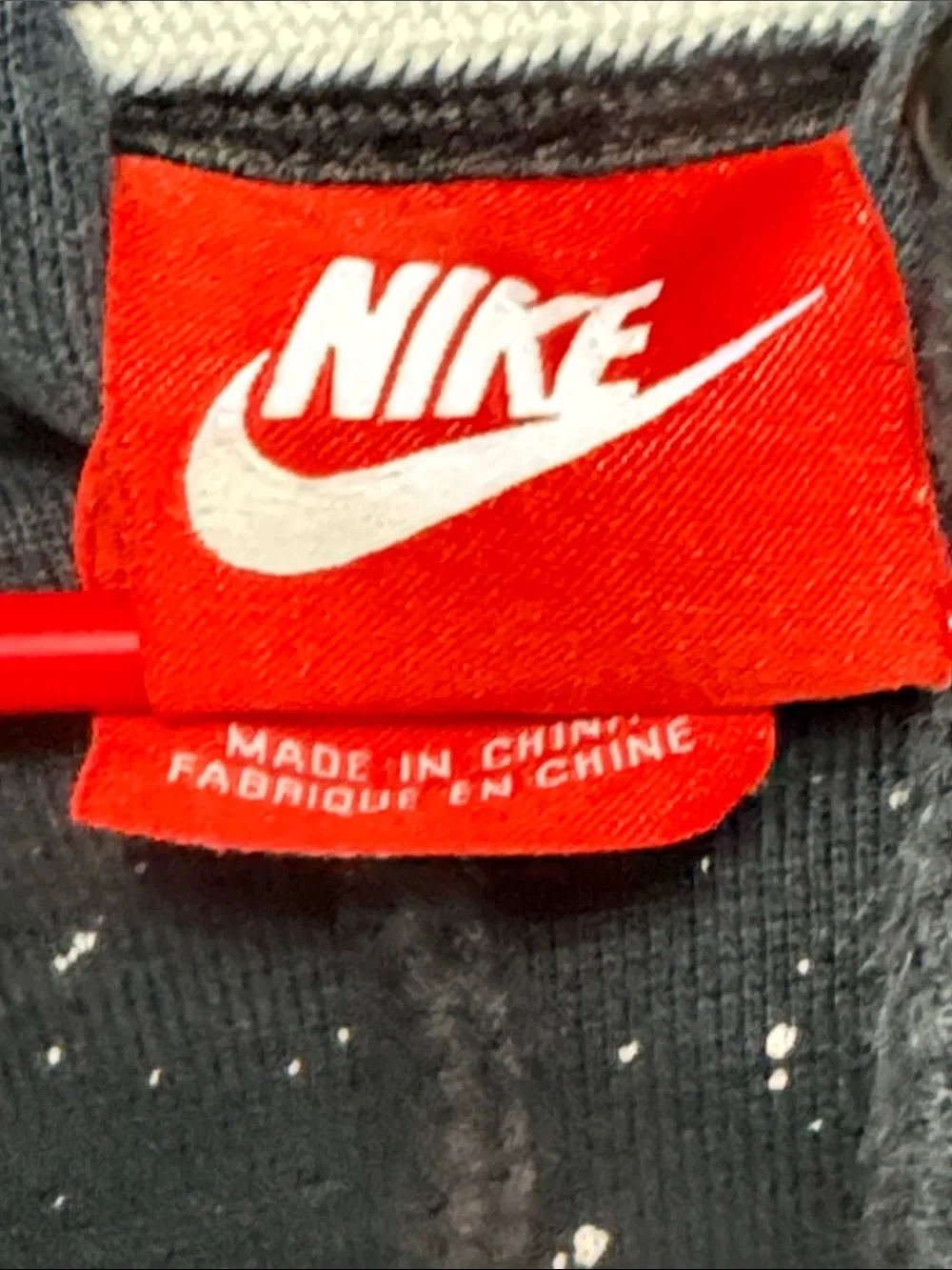 Nike Black Pullover Hoodie with White Swoosh and Paint Speckle